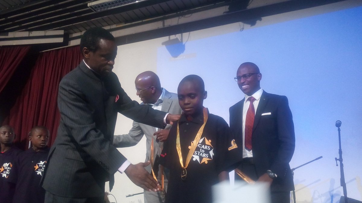 LoveMotorKenya's tweet photo. @MSenteu from @vivoenergykenya &amp; the guest of honours awarding today's stars with medals of honour #WorldOrphansDay #StarsOnly https://t.co/XClBZ6D35C