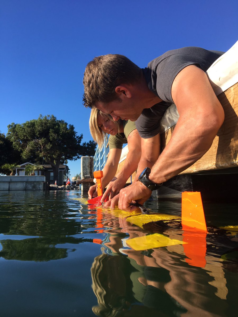 Chestley Howell and Kimberly Flax ballasting Orca's newest OceanServer IVER3 in prep for it's maiden dive to map a sunken trawler.