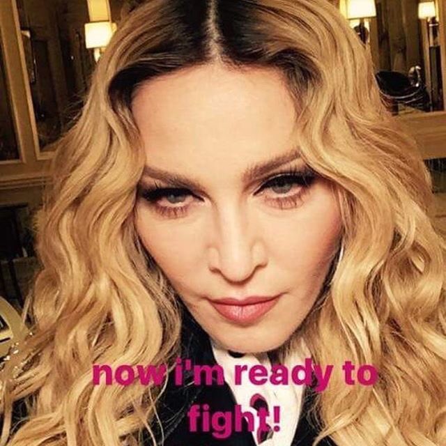 Madonna's tweet photo. Hello Friday! Let the Games Begin. Ready to fight Sexism Ageism Racism Homophobia and all other forms of Bigotry...https://t.co/ldzQ7F5LQF https://t.co/jSpFG1ps79