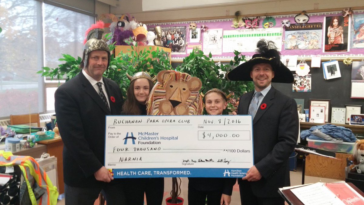 Representing the BPOC, future McMaster students Macy Diamond and Joseph Saccomano make donation to McMaster Children's Hospital Foundation.