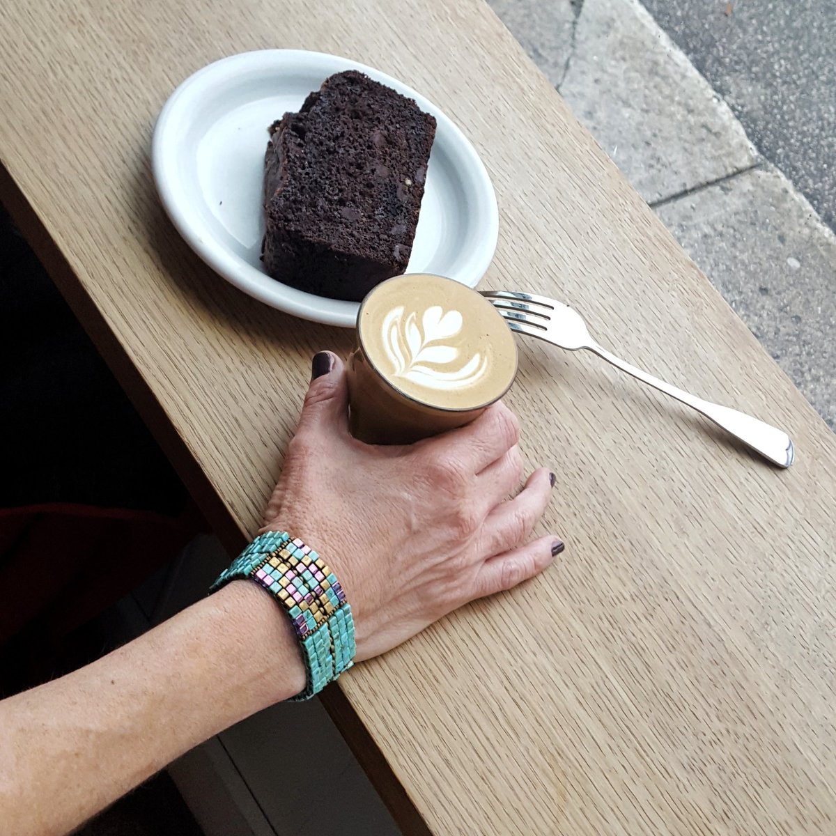 IlluminatedMeIM's tweet photo. A #chocolate slice and some #coffeeart at @Tandem_Coffee tastes especially good wearing the #magdalene #cuff. #extrayummy #goeswithfood https://t.co/7zQ9wurK7t