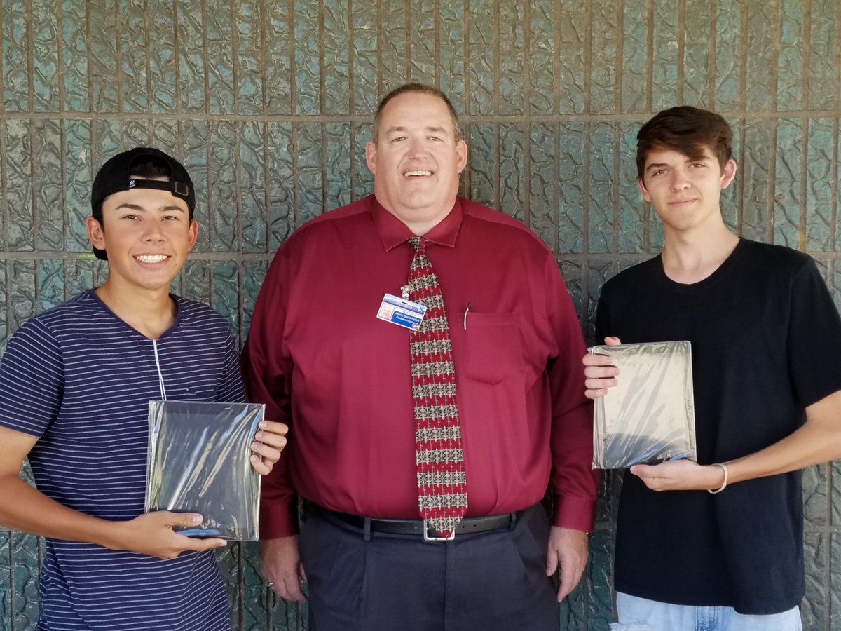 Jeff Litel from the Yucaipa Kiwanis Club presents Ipads to two lucky Seniors who applied for College on YHS College.  #HailKiwanis #Future