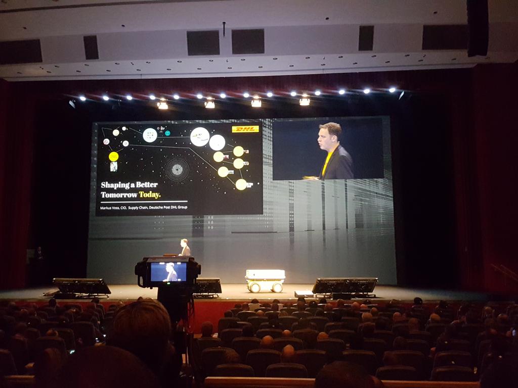 HarvardComms's tweet photo. "Shaping a better tomorrow today" - Make something meaningful. Change the world says #DHL at this year's #FujitsuForum https://t.co/fvGlaP3UfN