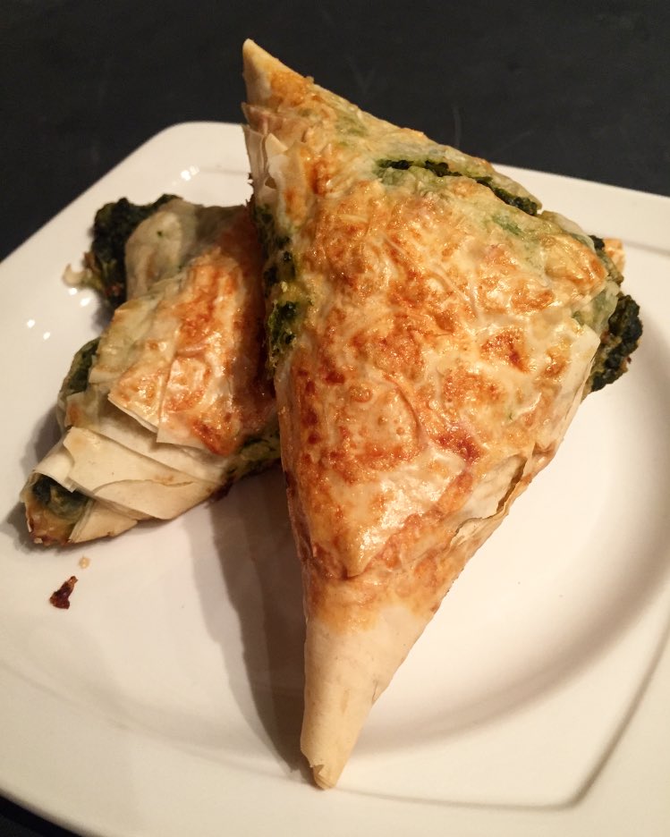 Our #spanakopita is handmade and freshly baked with steamed spinach, imported feta and flaky phyllo crust. It's delicious!