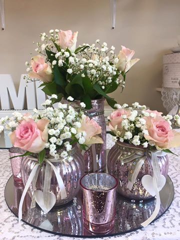 Eventbuddy's tweet photo. Loving our beautiful blush pink with three vases and matching tea lights, set on a mirror base with crystals @WeddingHour  #weddinghour https://t.co/fjJh3z4if3