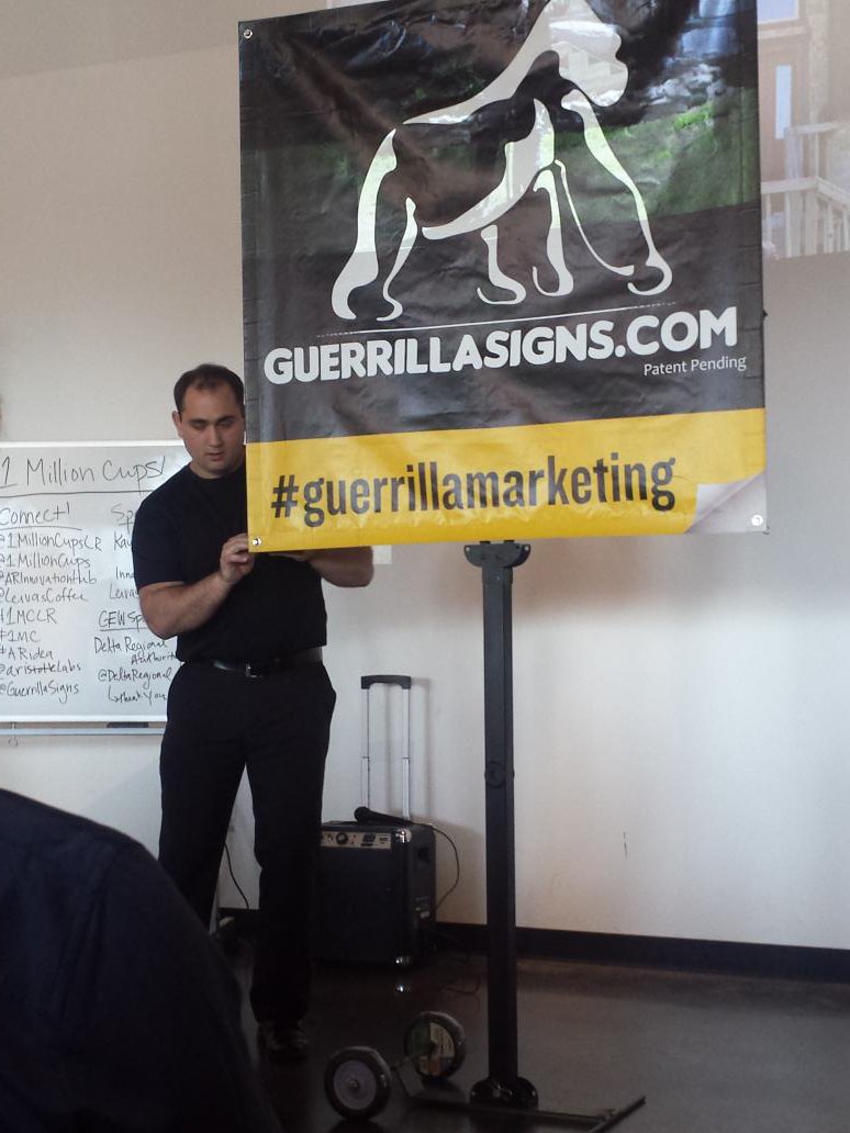 Dauphne's tweet image. Portable banner frame that requires no tools and sustains up to 80mph winds! Might need one of these ... #1MCLR