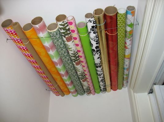 MKBoxStorage's tweet image. Home storage Ideas #38
Keep wrapping paper tidy by attaching a couple of pieces of string to the ceiling of a cupboard, like so.