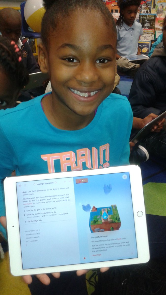 STEM_Nonprofit's tweet photo. This 2nd grader @adamsvilleps was all smiles after earning her 1st badge using Swift command on #ipad 2 collect a gem #STEAMCareerWeek #code https://t.co/gr36RAp27K