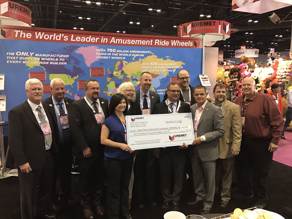 The #RollerCoaster Museum board members w/ reps from <a href="/UremetCorp/">Uremet Corp.</a> presenting them a $100,000 donation in #MarkMoore's name. #IAE16