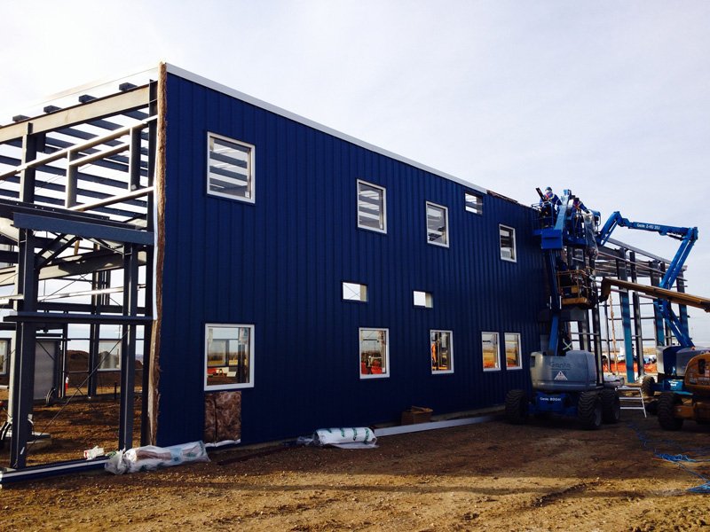 ProSteelLtd's tweet photo. The fellas putting on some siding. #ProSteelConstructors #steelbuildings #BuildingErectors #Ironworkers #MetalBuildings #SteelErectors https://t.co/RL4x4c24gY