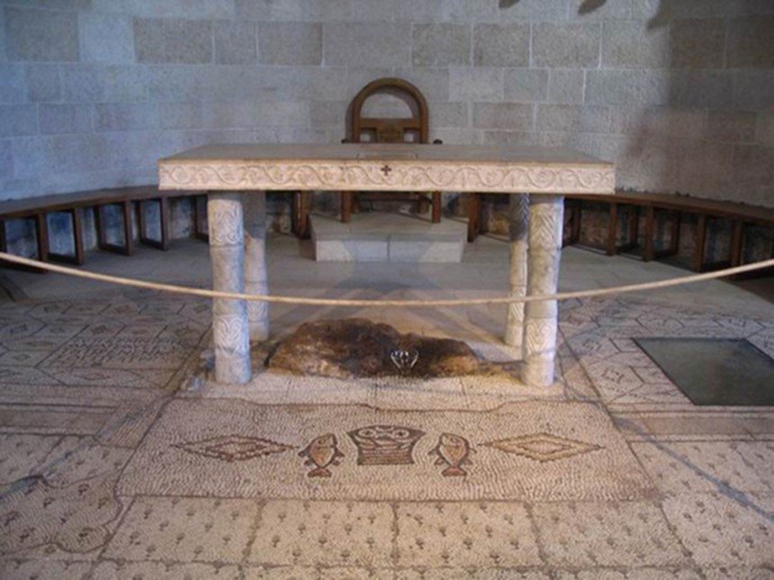 TrueHolyFace's tweet photo. Stone under the altar where Jesus laid the loaves&amp;fishes prior to blessing&amp;distributing them #ChurchOfTheMultiplication #Tabgha #HolyLand https://t.co/dD9IqyAUPz