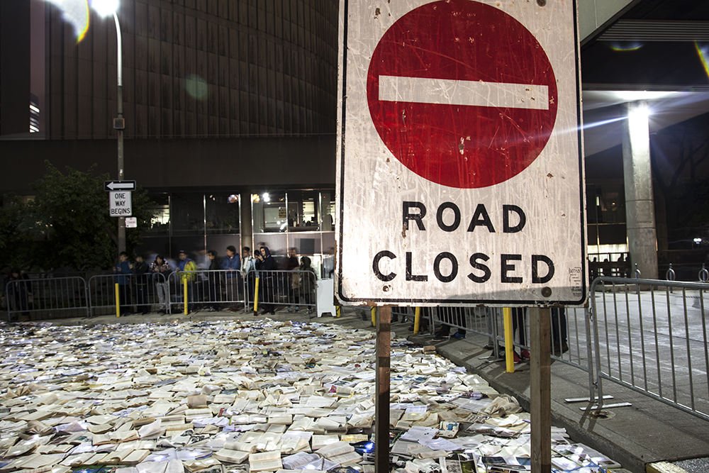 popupcity's tweet photo. The Traffic vs. Literature installation during @nuitblancheTO, illuminated Hagerman St. with glowing books: https://t.co/FmTuZvqbhp #nbTO16 https://t.co/1IX38P9yen