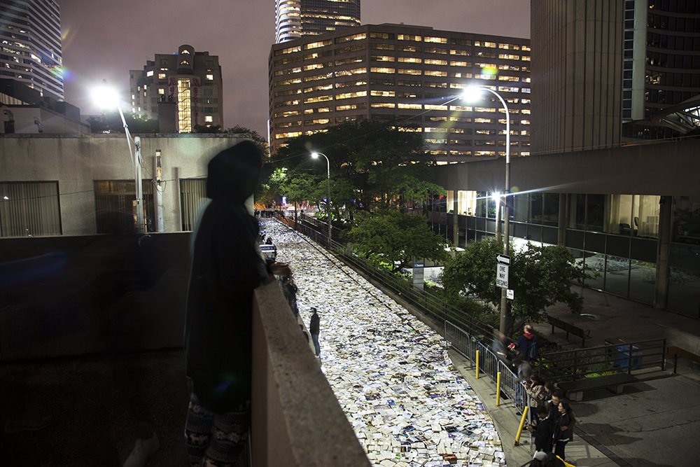 popupcity's tweet photo. The Traffic vs. Literature installation during @nuitblancheTO, illuminated Hagerman St. with glowing books: https://t.co/FmTuZvqbhp #nbTO16 https://t.co/tiBs3EfyDf
