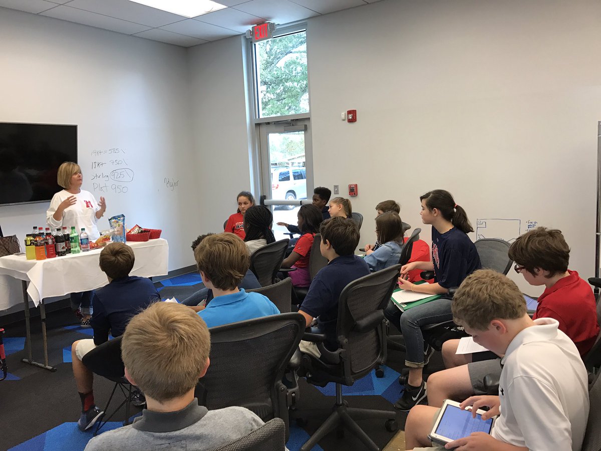 mrsrlovisa's tweet image. Melanie Manzella talking to @STM_Math7 about the math involved in running the concession stands @stmsaints