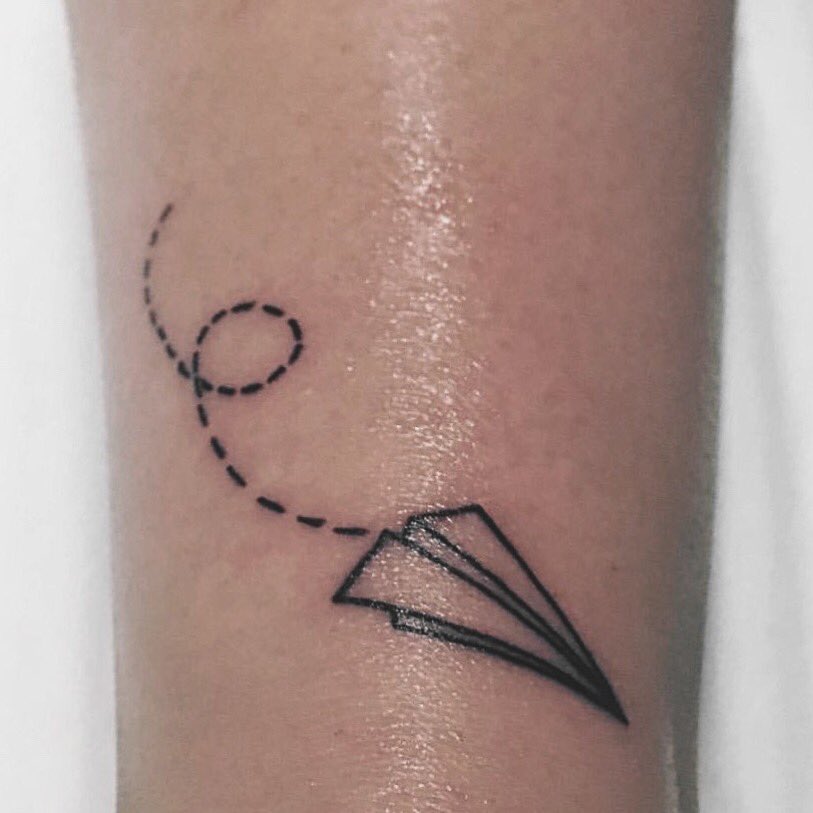 Tattoo uploaded by Claire • By #balazsbercsenyi #airplane #PaperAirplane # flight #minimalist #tinytattoo • Tattoodo
