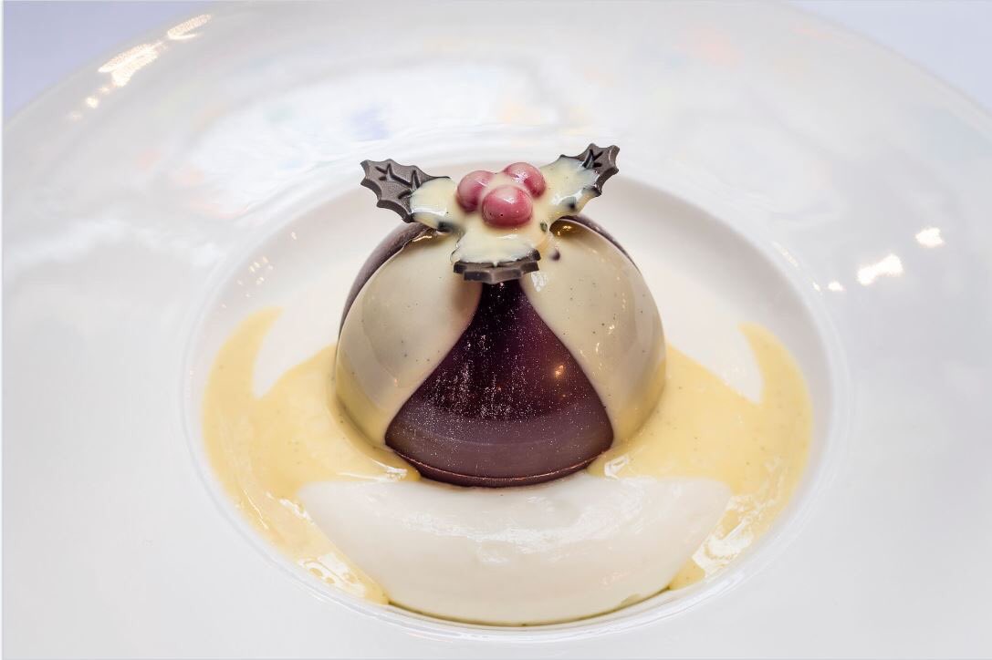 The Holly and the Ivy chocolate bombe - vanilla ice cream, Christmas Pudding, cranberry centre and hot brandy sauce - until 31 December