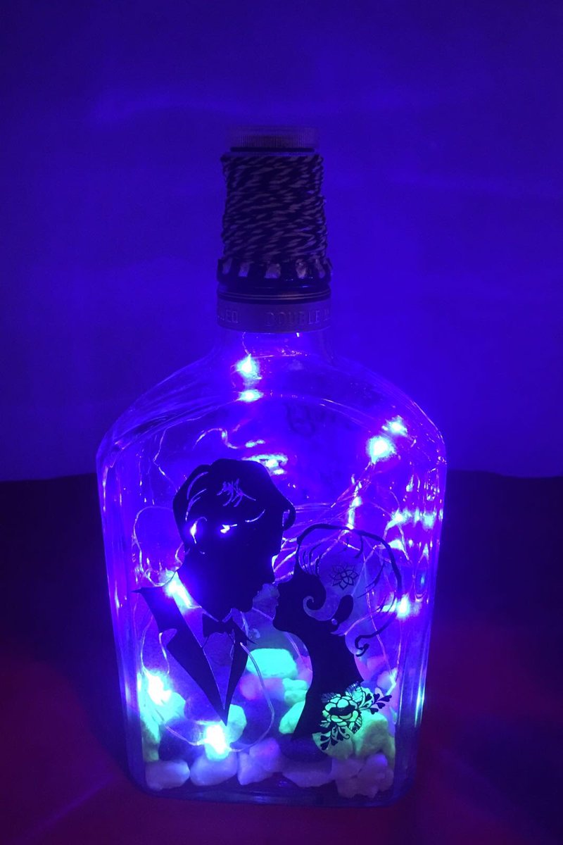 monkeydebris_c's tweet image. Upcycled Gentleman Jack bottle, blue LED&apos;s &amp;amp; silhouette. Wording on other sides reads Every love story is beautiful but ours is my favourite