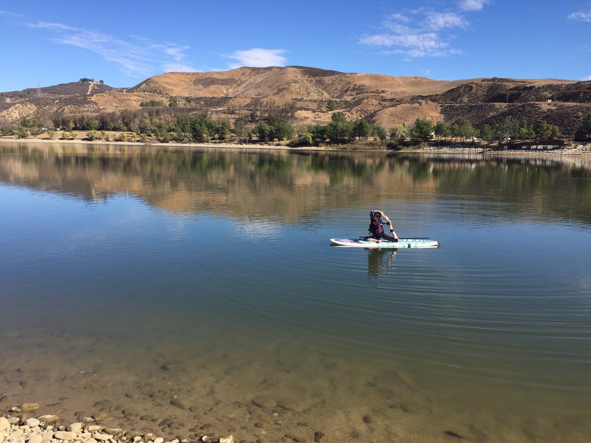 rinaslayter's tweet photo. I do not have enough superlatives to describe my first time on a standup paddle board. Nor for doing yoga on it. I didn't even fall in. https://t.co/0WEvnV8rzY