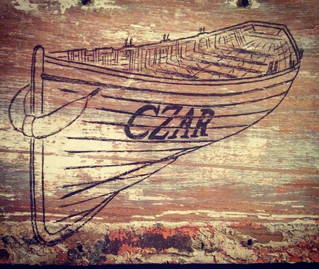 TrescoIsland's tweet photo. Stunning pic of Czar on one of her planks, saved during refurbishment, by Emma Bagnall-Oakeley #Tresco #Scilly #GigRow #Art #Island #Rowing https://t.co/VGPwMs4ll5