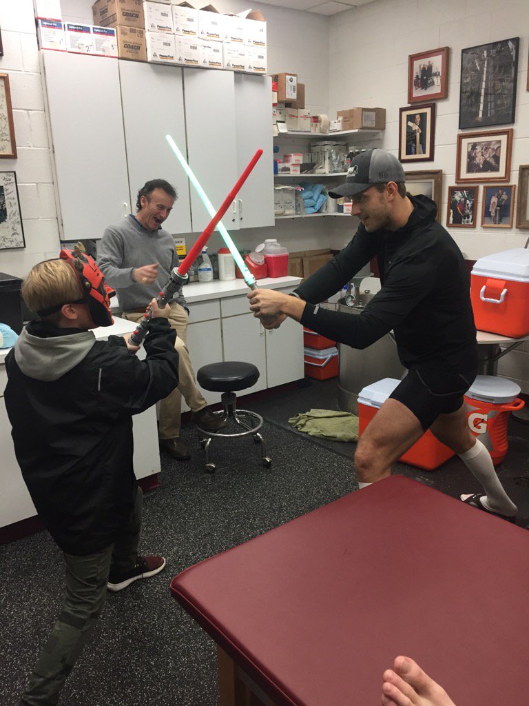 <a href="/PetteriLindbohm/">Petteri Lindbohm</a> and my young Jedi having an epic post-game light saber battle. Kids will be kids. #ChicagoWolves