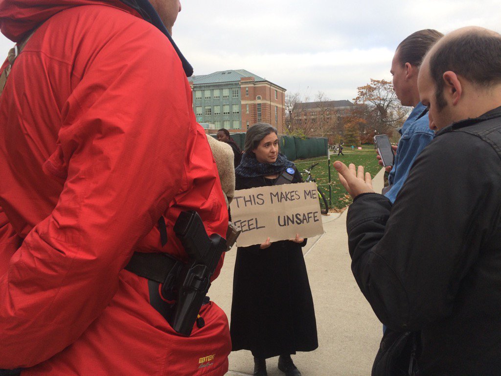 TheLantern's tweet photo. Protesters converse with a counter protester https://t.co/DvPwMFrYgp