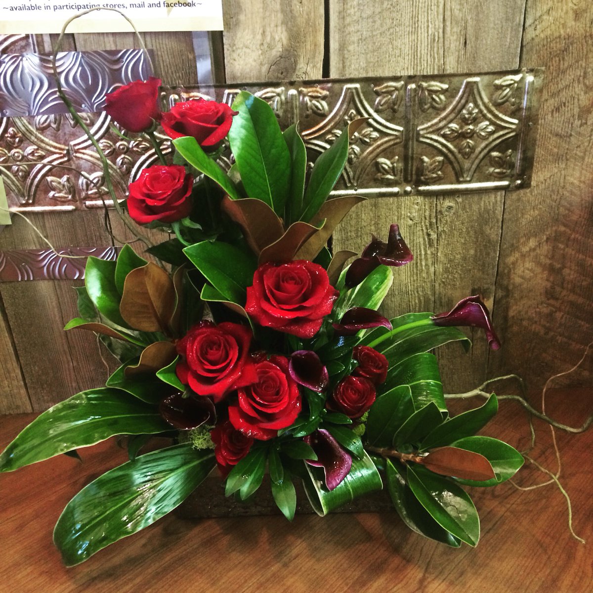 FunkyPetalsLeth's tweet photo. Stunning array of red roses, eggplant calla lilies and lush magnolia leaves. https://t.co/GVUQQoUiRk