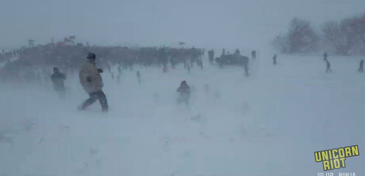 UR_Ninja's tweet photo. Veterans march on Hwy 1806 bridge at Standing Rock in blizzard conditions to continue support for #NoDAPL https://t.co/YIX7MqU87N https://t.co/WpetfgnzjJ