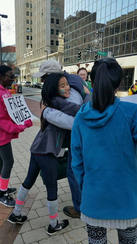 GCSchoolsNC's tweet photo. Students from Southeast High were downtown this Saturday during the Greensboro Holiday Parade spreading community cheer, one hug at a time. https://t.co/WryU5SD9uf