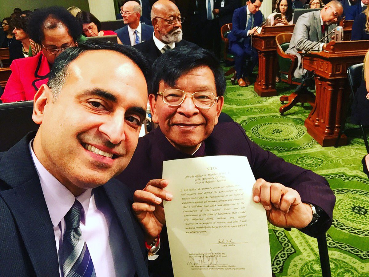 Ash_Kalra's tweet photo. My father holding my freshly signed Oath of Office! https://t.co/H8vFUoRjZO
