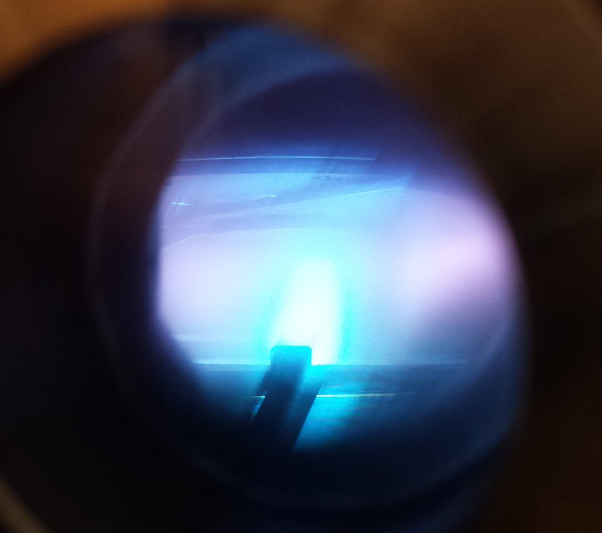 ICE_UTwente's tweet photo. A beautiful bright blue plasma created by sputtering Niobium. The purple is created by the ionized Argon sputtering gas. https://t.co/FGHRNpk6Je