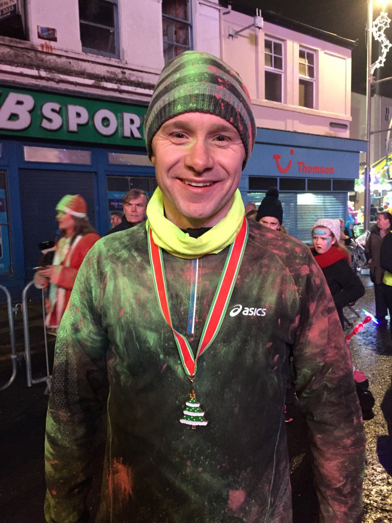 He's soooooo proud of his medal!