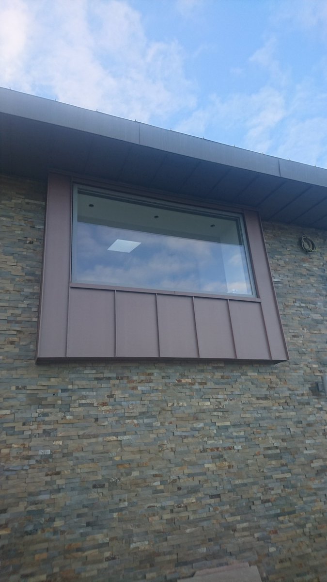 bsm_roofing's tweet photo. Vm Pigmento red standing seam cladding on a lovely house in Llandudno gives a modern slick look  @bsm_roofing @VMZINCUK https://t.co/NdZw1TmfBW