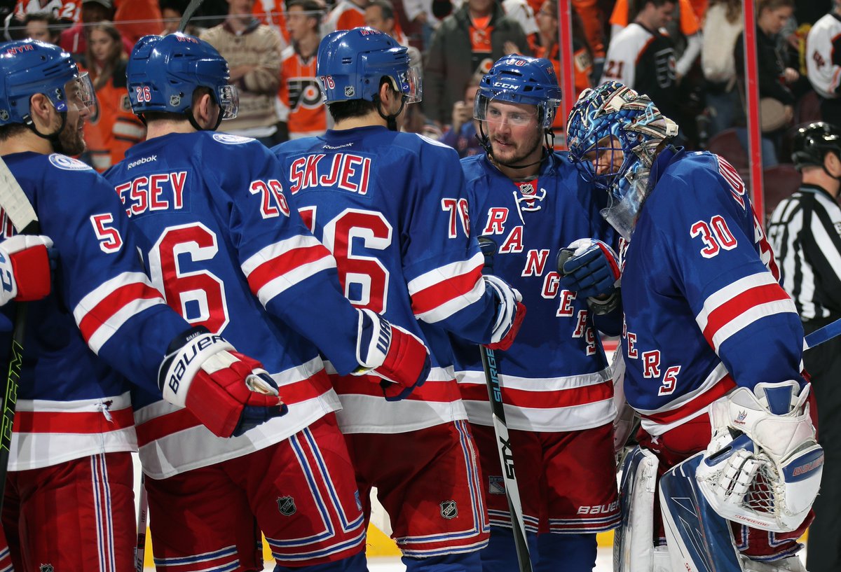 Teammates congratulate Henrik Lundqvist following a season high 40 saves that bailed the Rangers out in a 3-2 win over the Flyers on Black Friday. AP Photo via Getty Images courtesy NYRangers.
