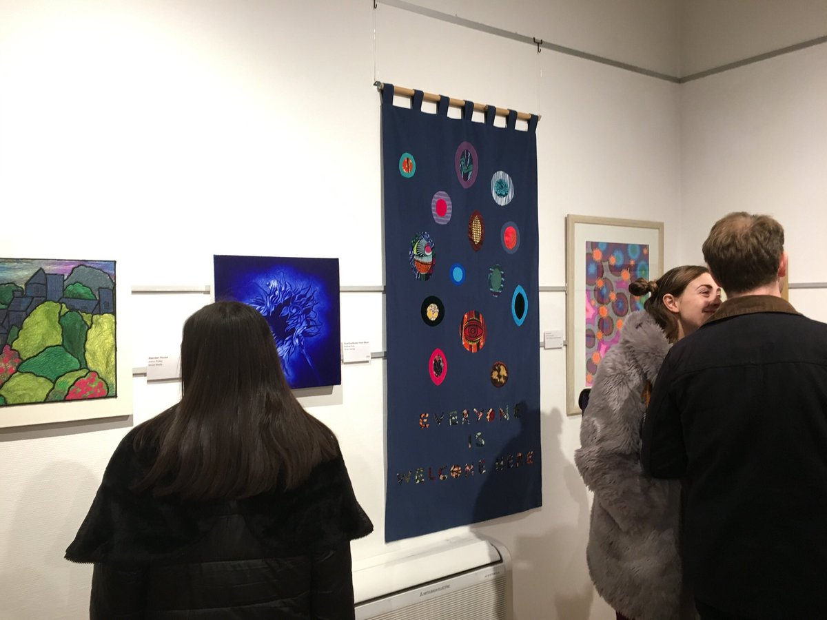 EmmaCameron9's tweet photo. Fab PV of #Open16 @WorthingMuseum Pleased with how my wallhanging 'Everyone Is Welcome Here' (about refugees) looks. Lots of great artwork. https://t.co/6Pfljbd21Y