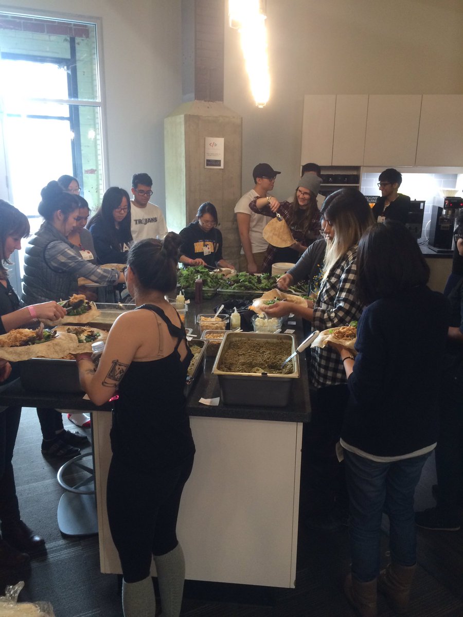 DevsWB's tweet photo. Communal dinning, hack break: build your own chicken wrap #breakinequality #devfuel https://t.co/5mV3tWGeAO