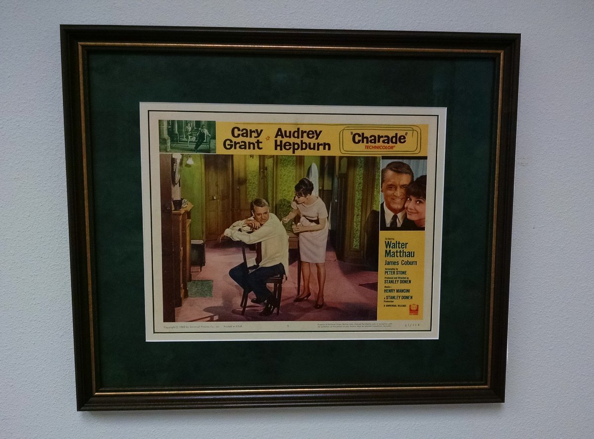 Cocophone's tweet photo. An old lobby card I framed up for my work office. "Charade" is a real fun movie! #HelloAudrey https://t.co/CrkEhMvpEO