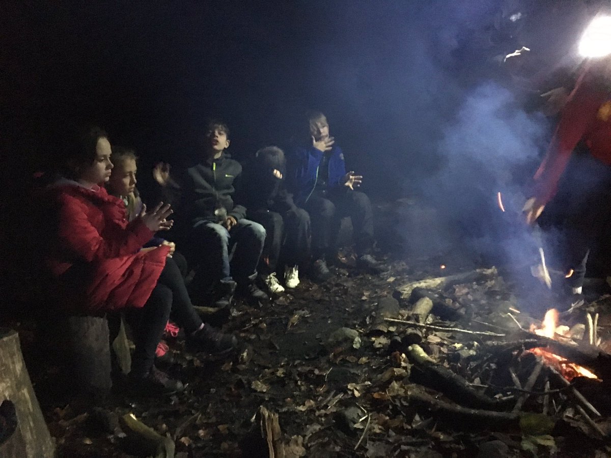 Evening fire baking bread and talking about their achievements of the day!!  fb.me/4TTl9pa4C
