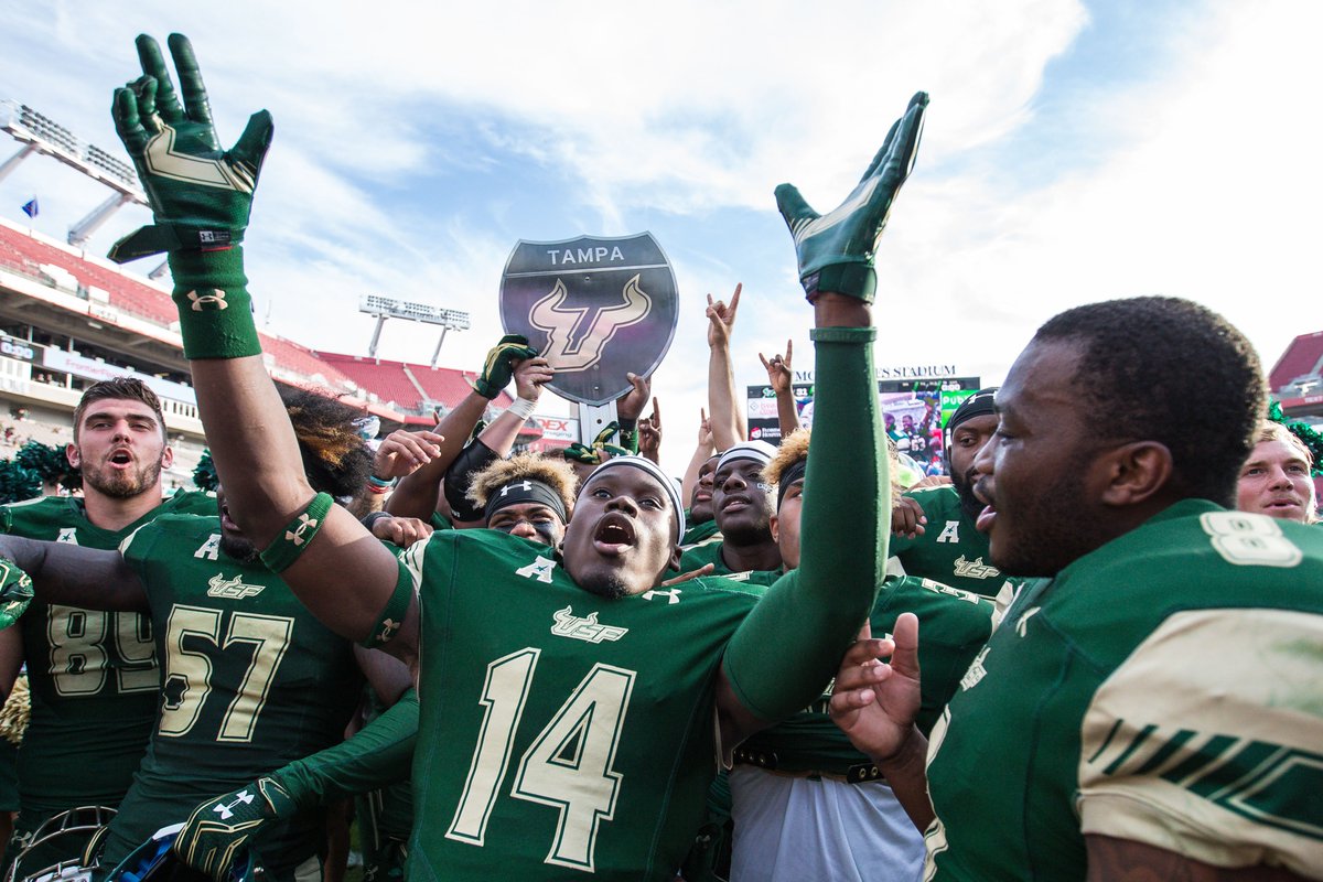 USFAthletics's tweet photo. What a feeling! The trophy is staying home in Tampa! #BullsUnite #WaronI4 https://t.co/pBGNiSX4Ac