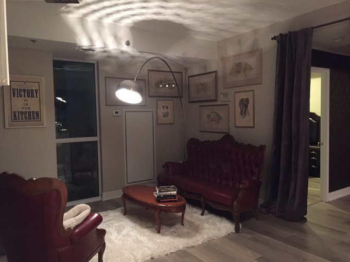 Sans bedroom curtains, new bed frame and bookcase to hide metal panel, but the new place is looking pretty