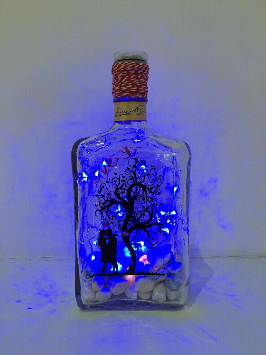 monkeydebris_c's tweet image. Upcycled and repurposed Disaronno bottle. Blue LED lights, coloured stones and love image. Beautiful 😍