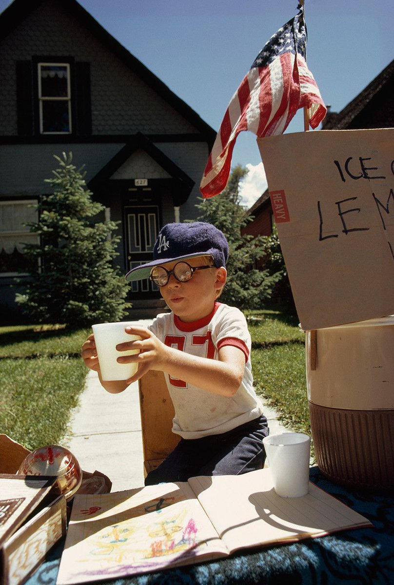 A boy sells lemonade from his front yard stand in 1973. Photograph by Dick Durrance II.