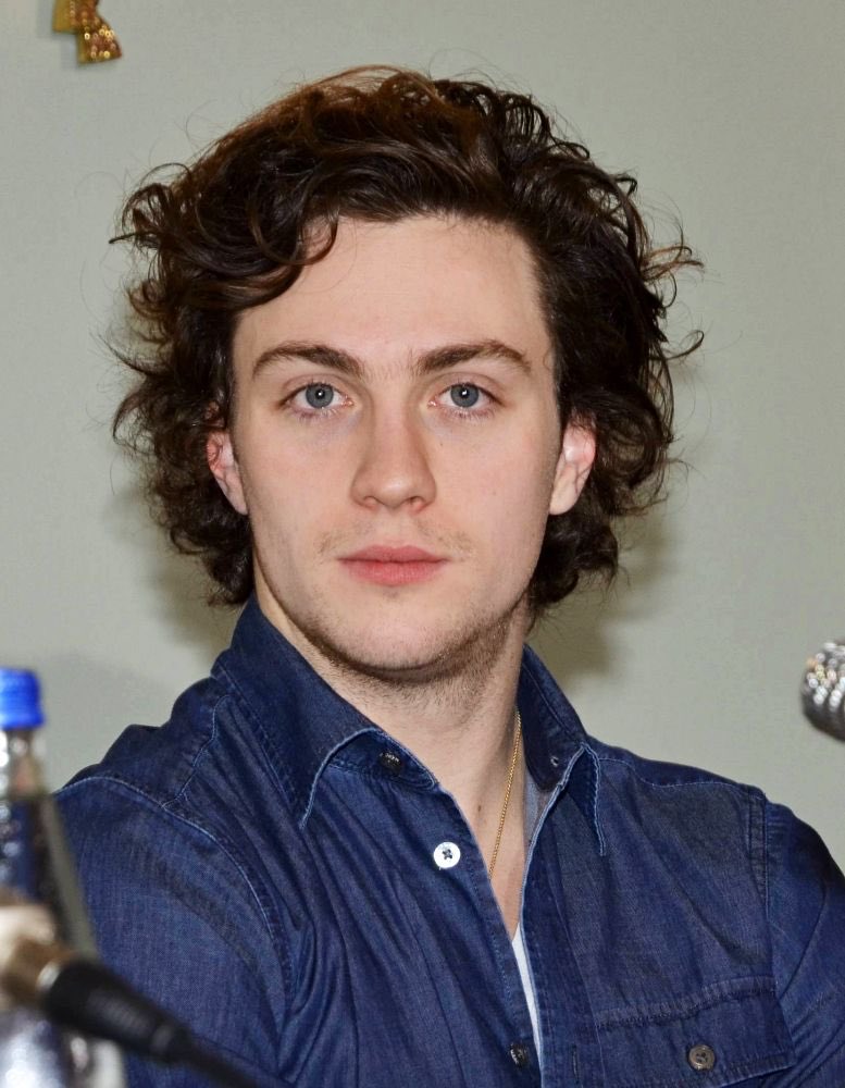 smackdemarco's tweet photo. can someone please agree with me that aaron johnson actually looks better in the first picture https://t.co/21xotzMDEB