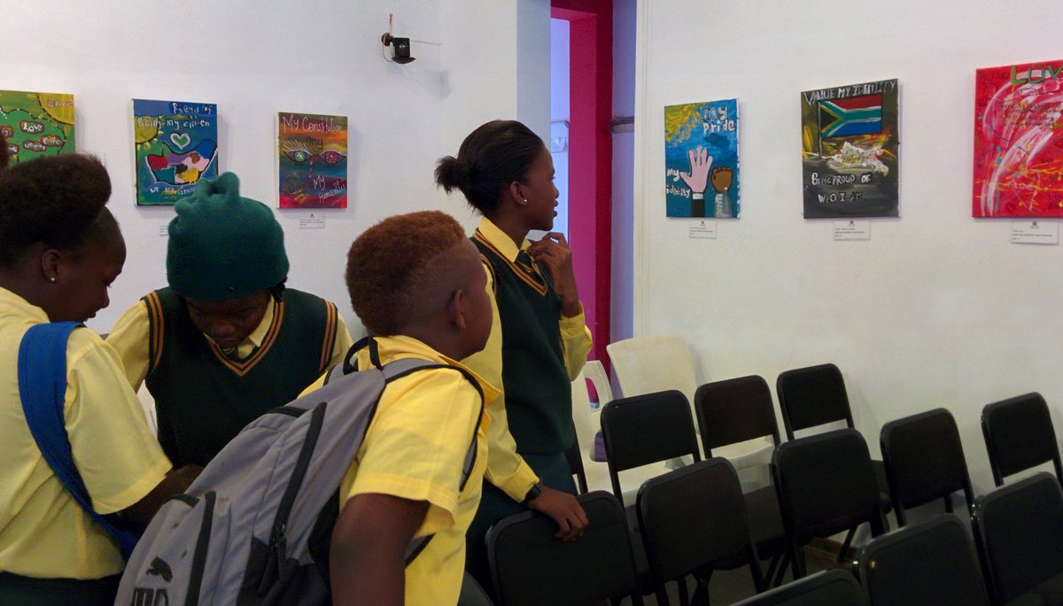 AF_Pretoria's tweet photo. Students looking at the works #HumanRights2016 @FrenchEmbassyZA @khulumaniafrica @CSA_UP @outlgbt #LesediLaBatho #ValuedCitizensInitiative https://t.co/3VIRCrxt0o