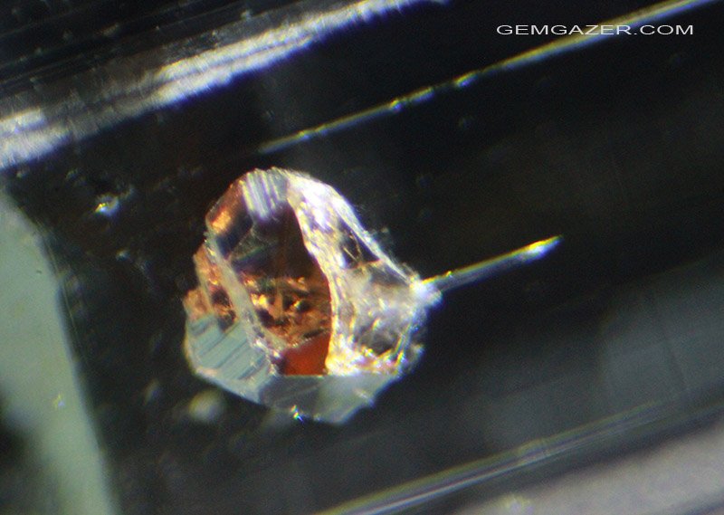 gemgazer's tweet photo. Spessartite Garnet inclusion in Aquamarine, Pakistan. https://t.co/0epIOFGM6a #gemInclusions #photomicrography #gemology https://t.co/FJcu9ZCa9E