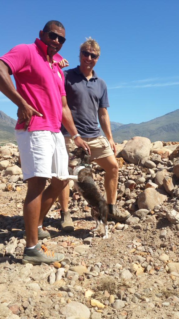 Land prep in stone soils. 80% stones. Very little soil.  Difficult. Juan &amp; Sheldon at Twee Jonge G, Tulbagh. Jakkals keeping spirits high.