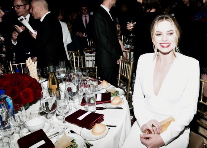 margot robbie sat at a full table by herself whilst awkwardly smiling to cover up the pain of her loneliness is me in every social situation