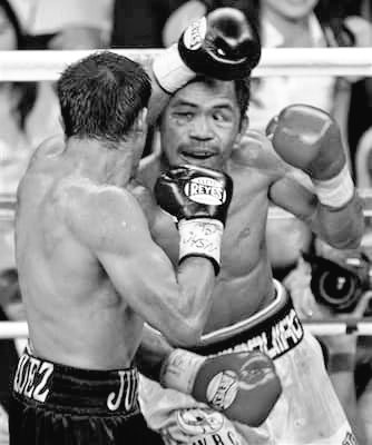 BoxingArchive's tweet image. In their classic 2nd meeting, both Pacquaio and Marquez pounded each other for 12 rds before Pac-Man walked away with the split decision.