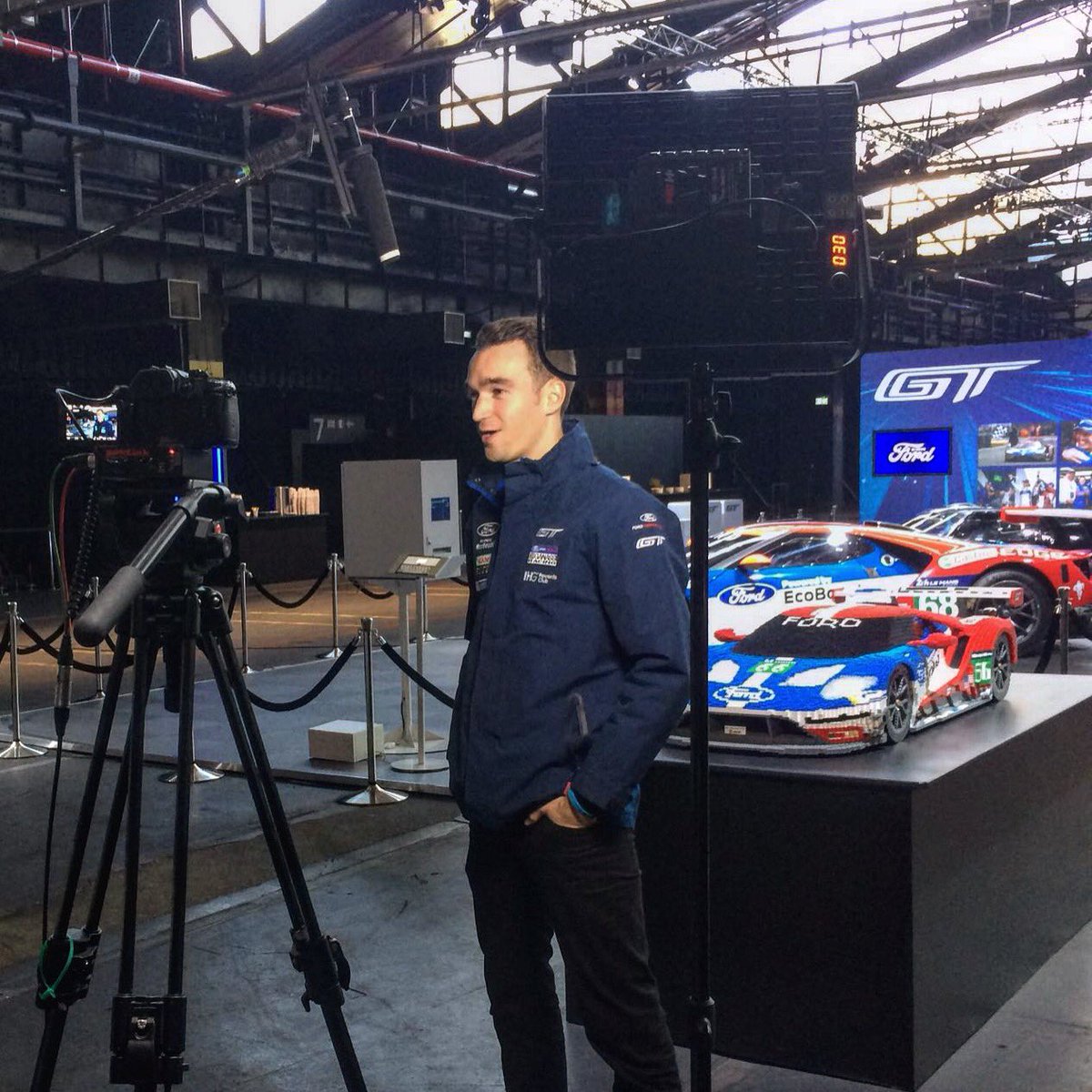 HarryTincknell's tweet photo. 1/10 scale @LEGO_Group model race car and the real thing in the background! Here in Cologne for @Ford's #GoFurther event! #Lego #Ford https://t.co/mrIYZJ13y0