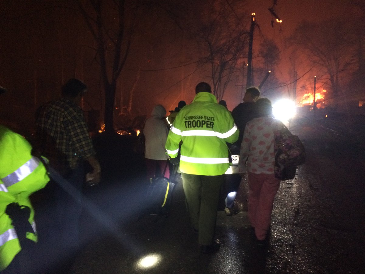 TNHighwayPatrol's tweet photo. Troopers walked into areas of Gatlinburg, Tn that were surrounded by fire to remove those who were trapped by flames. https://t.co/9r2lkAVy19