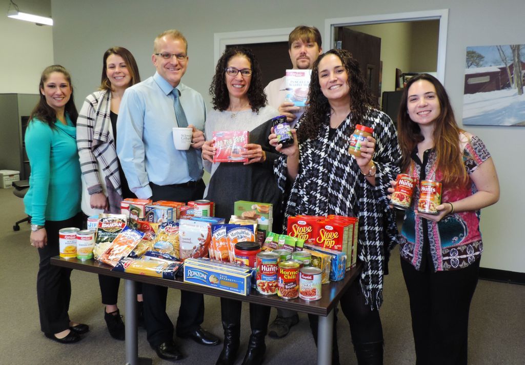 StJoesNYalumni's tweet photo. #SJCNYGives: Staff from @SJCNYAlumni &amp; Marketing/Communications with their donations for @SJCNY Campus Ministry's #Thanksgiving food drive. https://t.co/pnLgQtLzz7